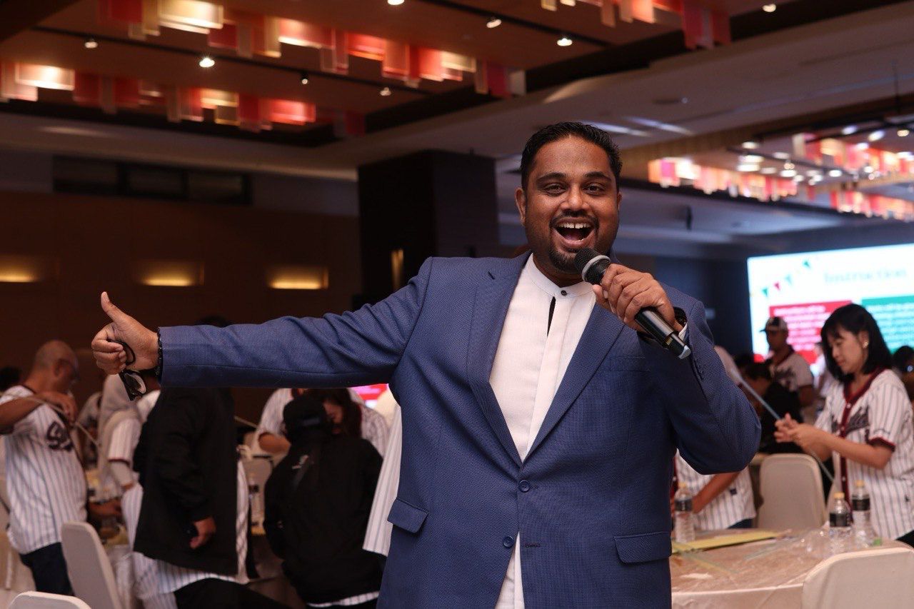 Lingesh speaking at a corporate conference